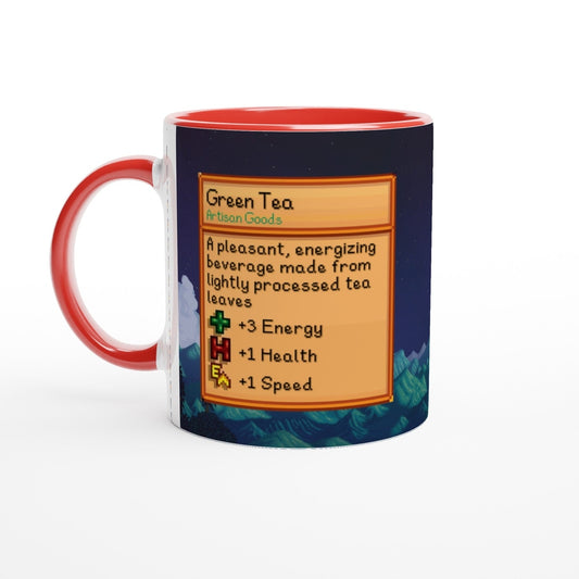 A Stardew Valley green tea mug features a label describing the beverage's effects and artisan goods origin, alongside a landscape background and red coloured handle.