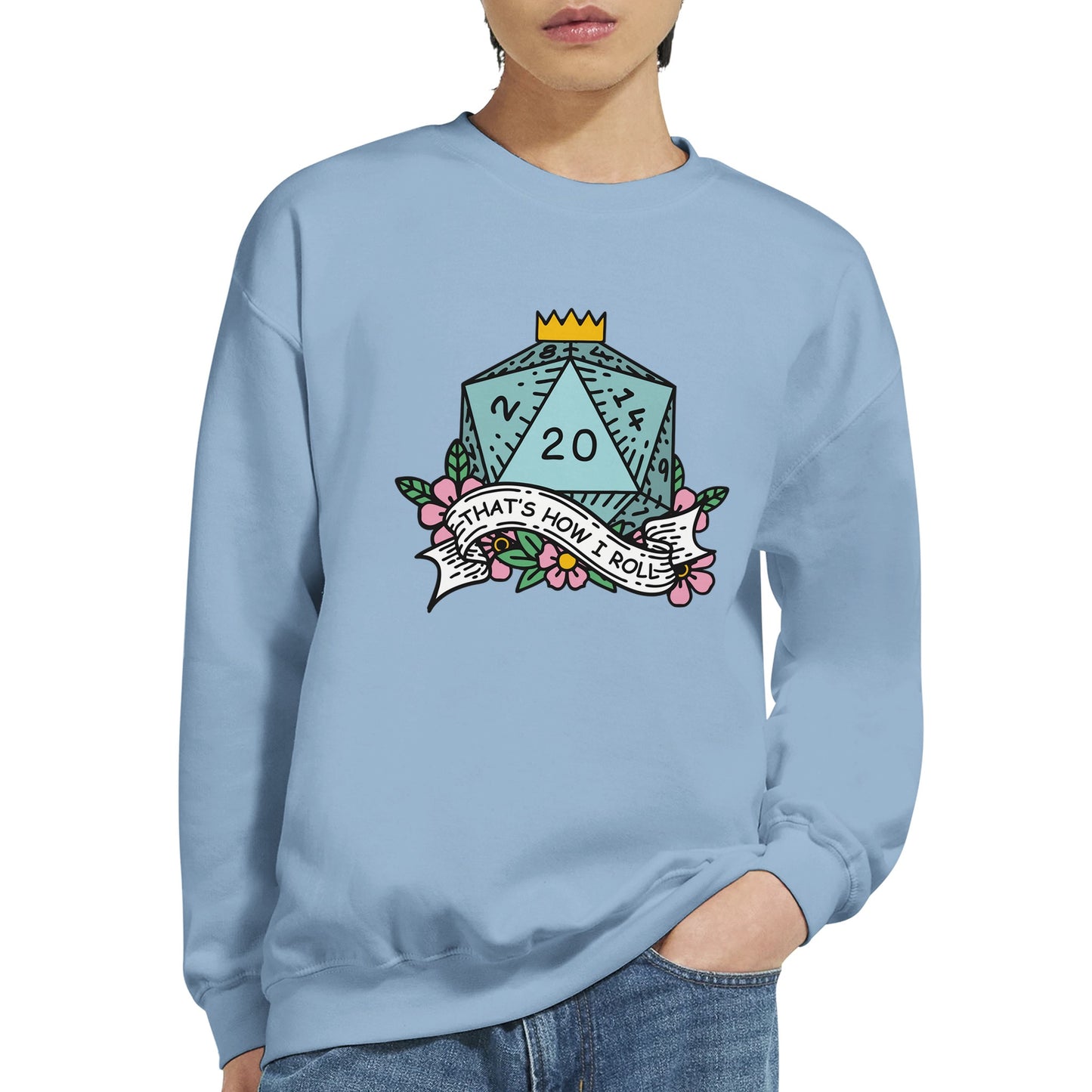 A person wears a Gildan® 18000 crewneck sweatshirt featuring an illustration of a D&D d20 die surrounded by flowers and the phrase "That's How I Roll.