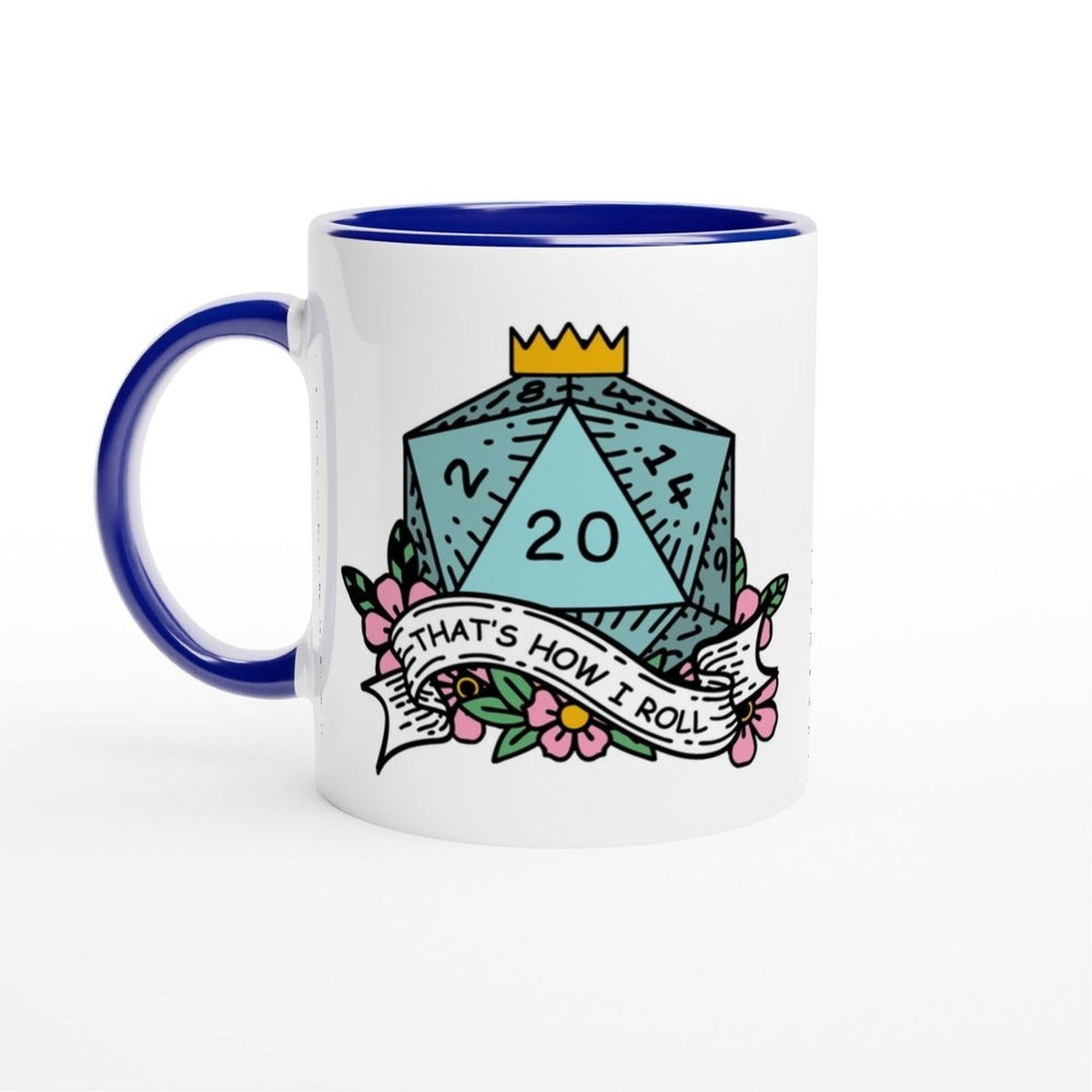 A white mug with a blue rim and handle features an illustration of a D20 die surrounded by floral elements and the phrase "That's How I Roll" referencing D&D humor.