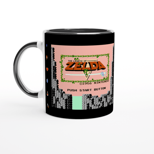 A white mug displays a reproduction of the 1986 Nintendo Entertainment System title screen for The Legend of Zelda video game.