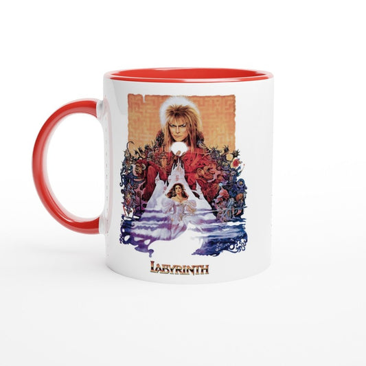 A white mug with a red handle and rim features artwork from the 1986 fantasy movie Labyrinth depicting Jareth the Goblin King and Sarah in front of a labyrinth design, with "Labyrinth" printed at the bottom.