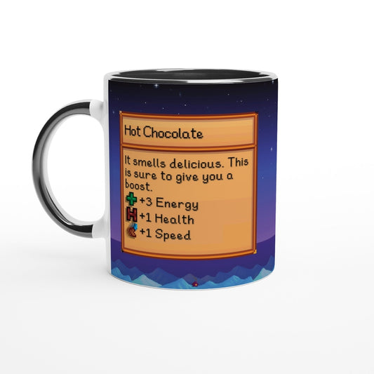 A Stardew Valley hot chocolate mug displays a graphic resembling an item card with stats for energy, health and speed against a blue mountain background.