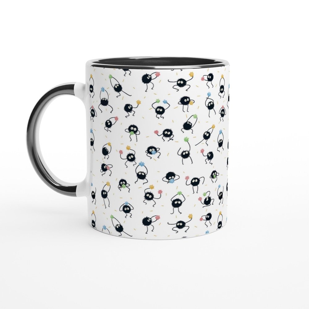A white 11oz mug features a repeating pattern of Susuwatari, also known as dust sprites from Studio Ghibli's Spirited Away.