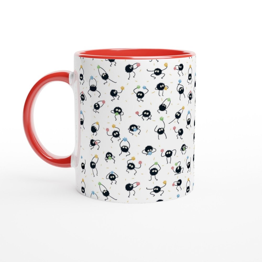A white mug with a red handle and rim features a repeating pattern of black Susuwatari, also known as dust sprites from Spirited Away.