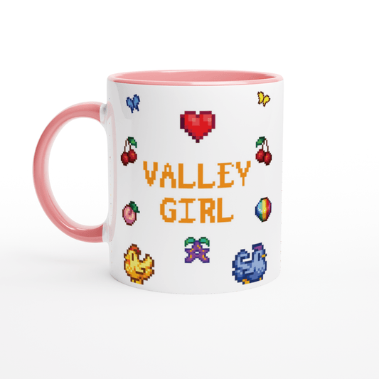 A white coffee mug features pixel art icons from Stardew Valley including cherries, a heart, and the words "Valley Girl" in a retro font.