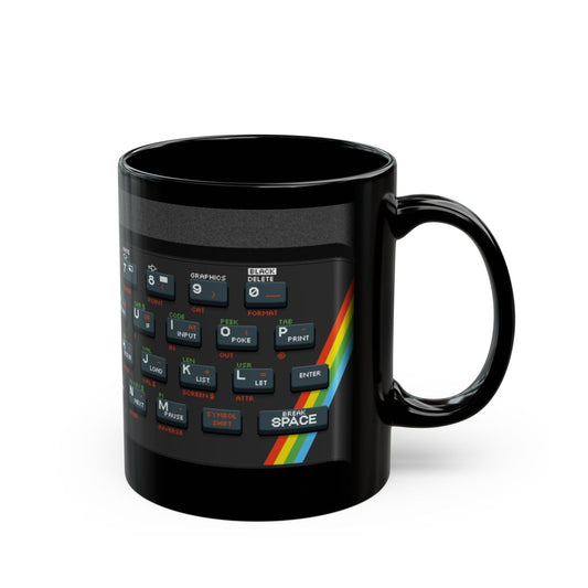 A black mug displays pixel art graphics resembling a Retro Spectrum keyboard layout.