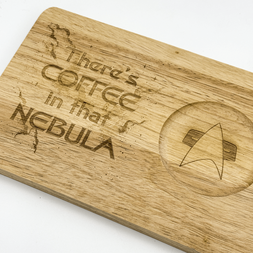 A wooden Voyager "Breakfast Board" features laser-engraved text reading "There's Coffee in that Nebula" and a Starfleet delta shield logo.