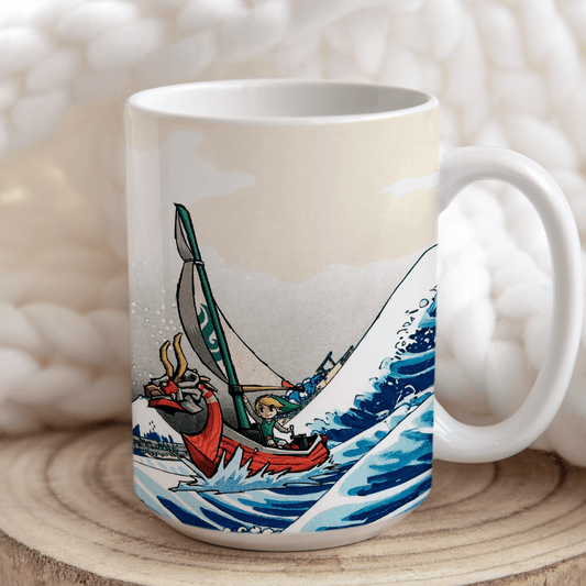 A white mug depicts Link from Legend of Zelda Wind Waker sailing a boat inspired by Hokusai's Great Wave off Kanagawa.