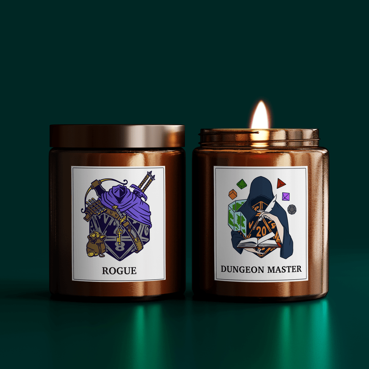 Two DnD scented candles are displayed side-by-side, one labeled "Rogue" and the other "Dungeon Master," each featuring custom illustrations on their lids.