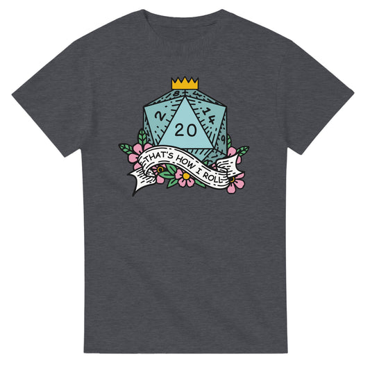 A dark gray t-shirt displays a D20 die surrounded by floral elements and a banner reading "That's How I Roll," referencing the D&D game.
