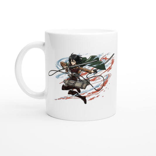 A white ceramic mug displays an illustration of Mikasa Ackerman from the Attack on Titan anime series wielding her blades against a swirling background.