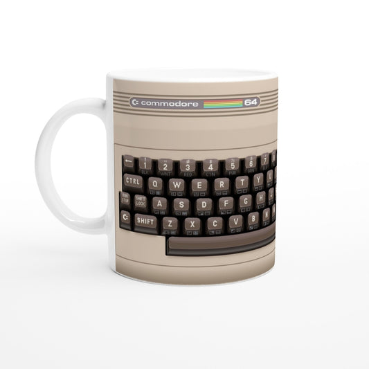 A ceramic mug displays pixel art of a Commodore 64 keyboard with the "Commodore" and "64" logos visible at the top.
