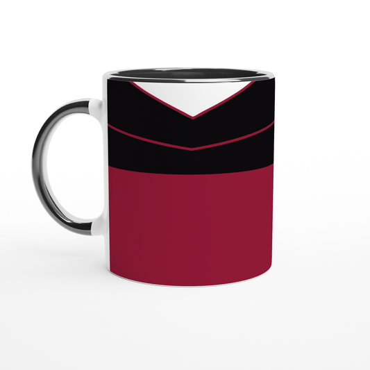 A white mug displays a design inspired by a Star Trek TNG uniform featuring red, black, and white panels.