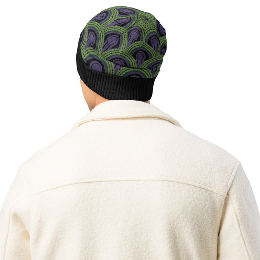 Man wearing a green, purple and black Room 237 Overlook Hotel patterned knitted beanie from The Shining
