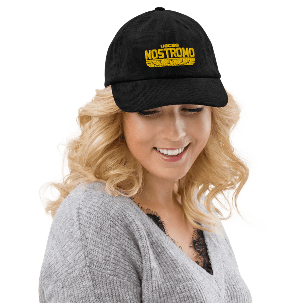 A person wearing a black Alien USCSS Nostromo embroidered hat with a Wings Style logo on the front.