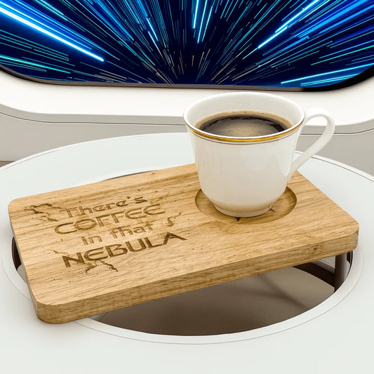 A wooden Voyager Breakfast Board displays the phrase "There's Coffee in that Nebula" and holds a mug of coffee against a backdrop resembling a space nebula.
