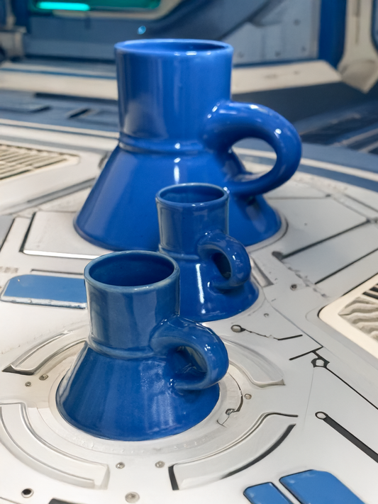 Mini blue raktajino mugs in the works, two small and one large. Ideal for Star Trek fans.