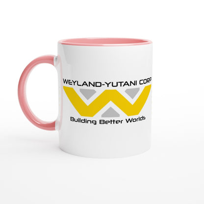 A white mug features a pink handle and rim, displaying the Weyland-Yutani Corporation logo and tagline "Building Better Worlds.