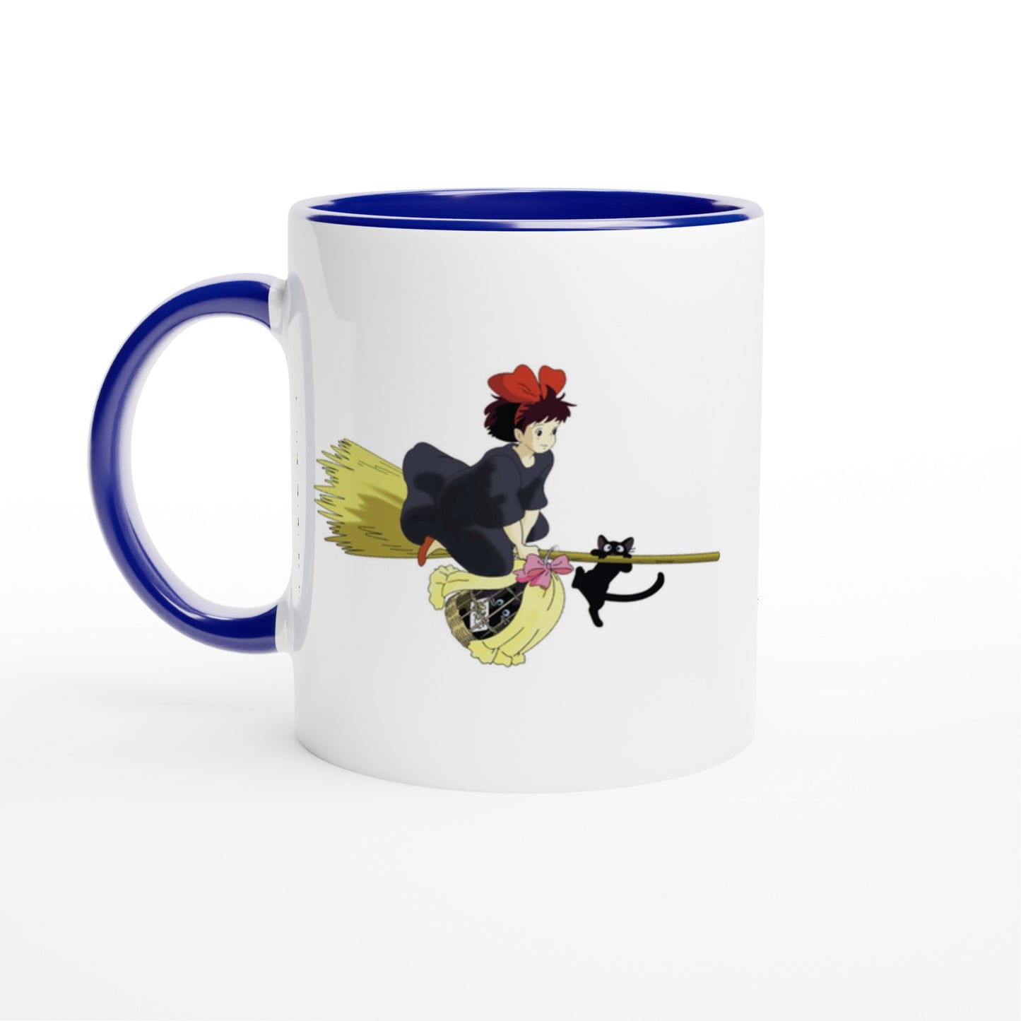 A white mug features a Studio Ghibli inspired illustration of Kiki on her flying broomstick with Gigi, a black cat.