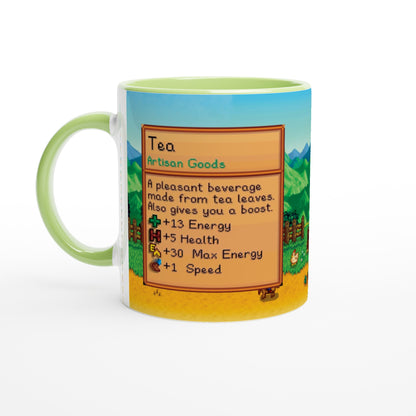 This Stardew custom tea mug features a pixelated design of a tea recipe card and background inspired by the video game Stardew Valley, with a green handle.