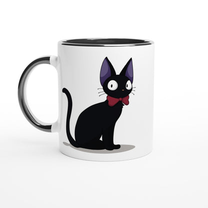 A white mug depicts Gigi the Cat, a black cat from Kiki's Delivery Service, wearing a red bow tie.