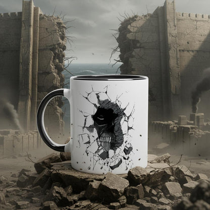 A white ceramic mug with a black handle features a design depicting the Colossal Titan breaking through a wall from the Attack on Titan anime.