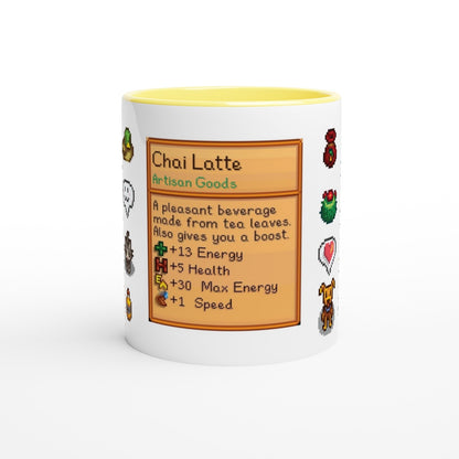 A white mug with a yellow rim displays a Stardew Drinks pattern featuring a Chai Latte recipe card with pixelated sprites and stats.