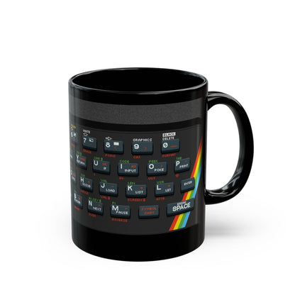 A black mug features pixel art graphics resembling a Retro Spectrum keyboard design.
