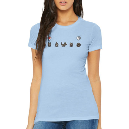 A woman wearing a light blue Stardew Valley T-shirt displays grey cat and emote graphics across the chest.