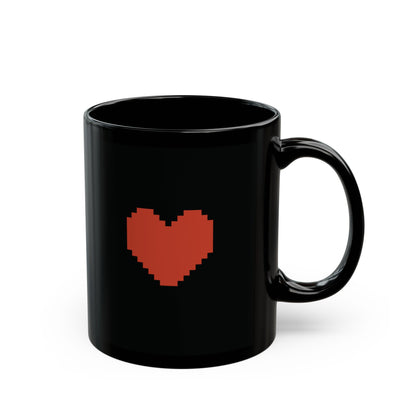 A black Undertale mug displays a pixelated red heart graphic on its front.