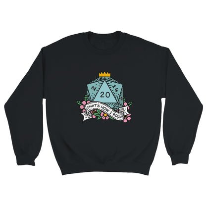 A black Gildan® crewneck sweatshirt displays a D&D-themed graphic featuring a twenty-sided die and ribbon reading "That's How I Roll.