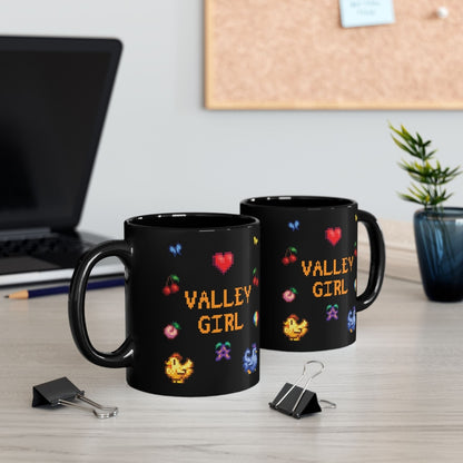 Two black coffee mugs with pixel art sprites / graphics from Stardew Valley including a heart, cherries, a prismatic shard, a stardrop, and butterflies.