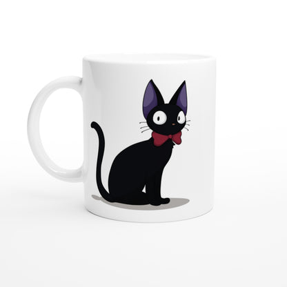 A white mug displays an illustration of Gigi the Cat, a black cat wearing a red bow tie, inspired by Studio Ghibli's Kiki's Delivery Service.