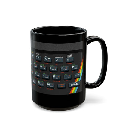 A black mug features pixel art graphics resembling a Retro Spectrum keyboard layout.