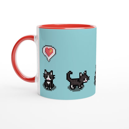 A white mug features pixel art of tuxedo cats and a heart, referencing the Stardew Valley computer game.