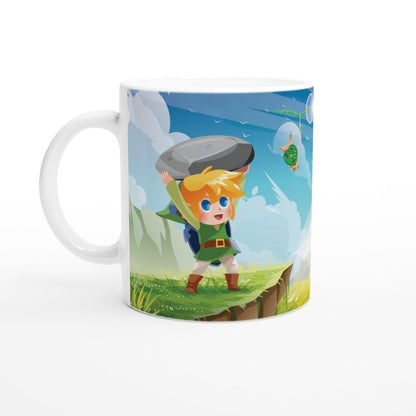 A white mug displays a cartoon illustration of chibi Link from The Legend of Zelda struggling to lift a large rock while a Korok watches nearby.