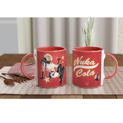 A red mug displays a vintage distressed poster design featuring a Fallout Nuka Cola pin-up girl and logo.