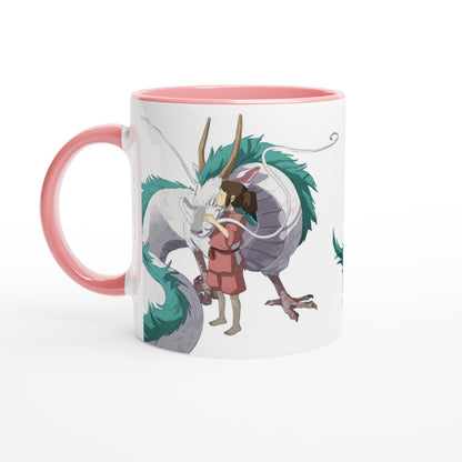 A white mug depicts Chihiro hugging Haku, a dragon from Studio Ghibli's Spirited Away.