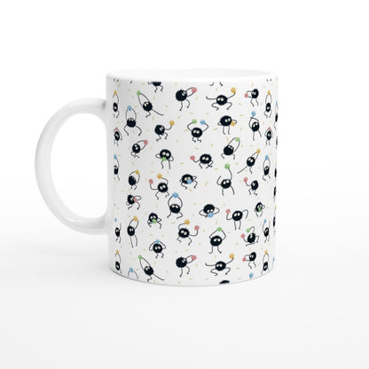 A white 11oz mug displays a pattern of black Susuwatari dust sprites from Studio Ghibli's Spirited Away.