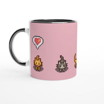A white mug displays pixel art graphics from Stardew Valley featuring ginger and tabby cats alongside a heart emote.