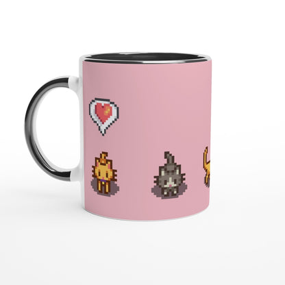 A white mug displays pixel art graphics from Stardew Valley featuring ginger and tabby cats alongside a heart emote.