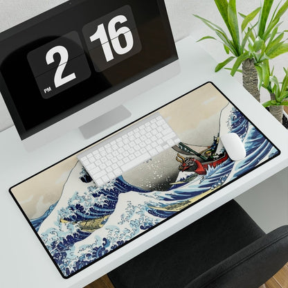 A large desk mat depicts Link from The Legend of Zelda: Wind Waker sailing a boat within Hokusai’s Great Wave off Kanagawa.