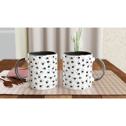 Two white 11oz mugs display a pattern of Susuwatari, also known as Soot Sprites from Studio Ghibli's Spirited Away.
