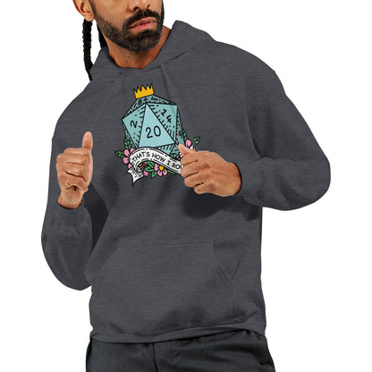 A man wearing a dark gray D&D hoodie displays a graphic of a D20 die and castle tower with the words "That's How I Roll.