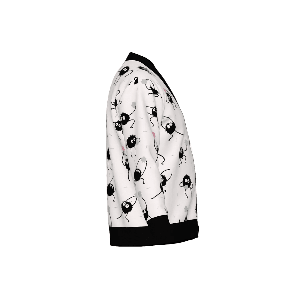 Spirited Away cardigan with Soot Sprites knitted pattern and black trim on a white background