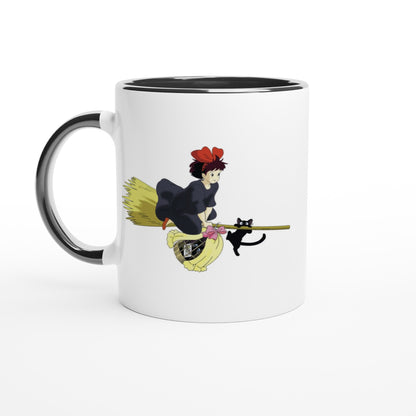 The white mug depicts Kiki from Kiki's Delivery Service riding a flying broomstick alongside her cat Gigi, inspired by Studio Ghibli.