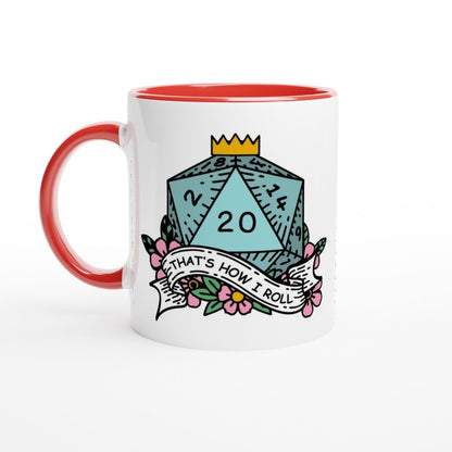 A white mug with a red interior and handle features an illustration of a D20 die with floral accents and the words "That's How I Roll.