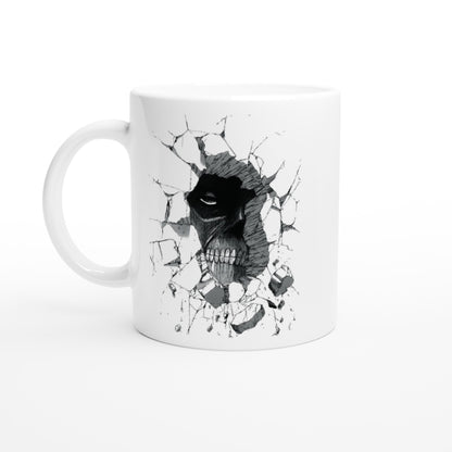 A white ceramic mug features a black and gray illustration of the Colossal Titan from Attack on Titan breaking through a wall.