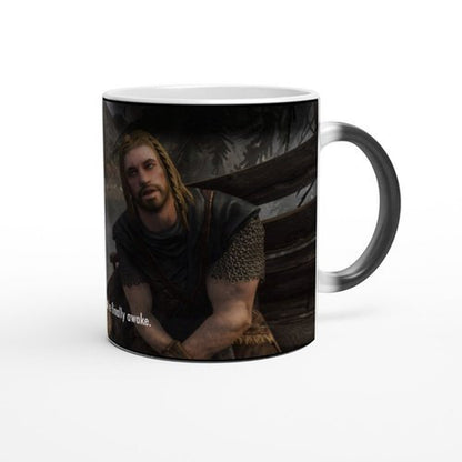 This is a white ceramic mug featuring an image from Skyrim depicting a character and text that reads "You're Finally Awake.
