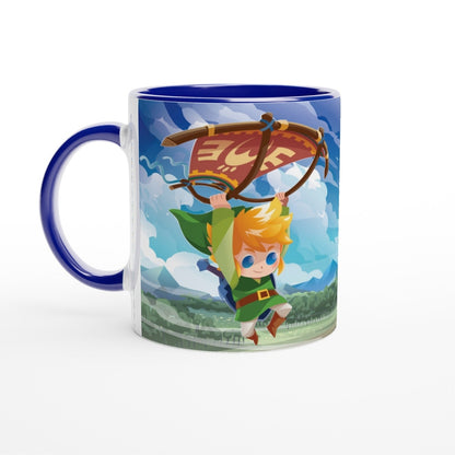 An 11oz mug depicts a chibi Link from The Legend of Zelda: Tears of the Kingdom soaring through a Hyrule landscape using a paraglider, with the Triforce symbol prominently displayed.